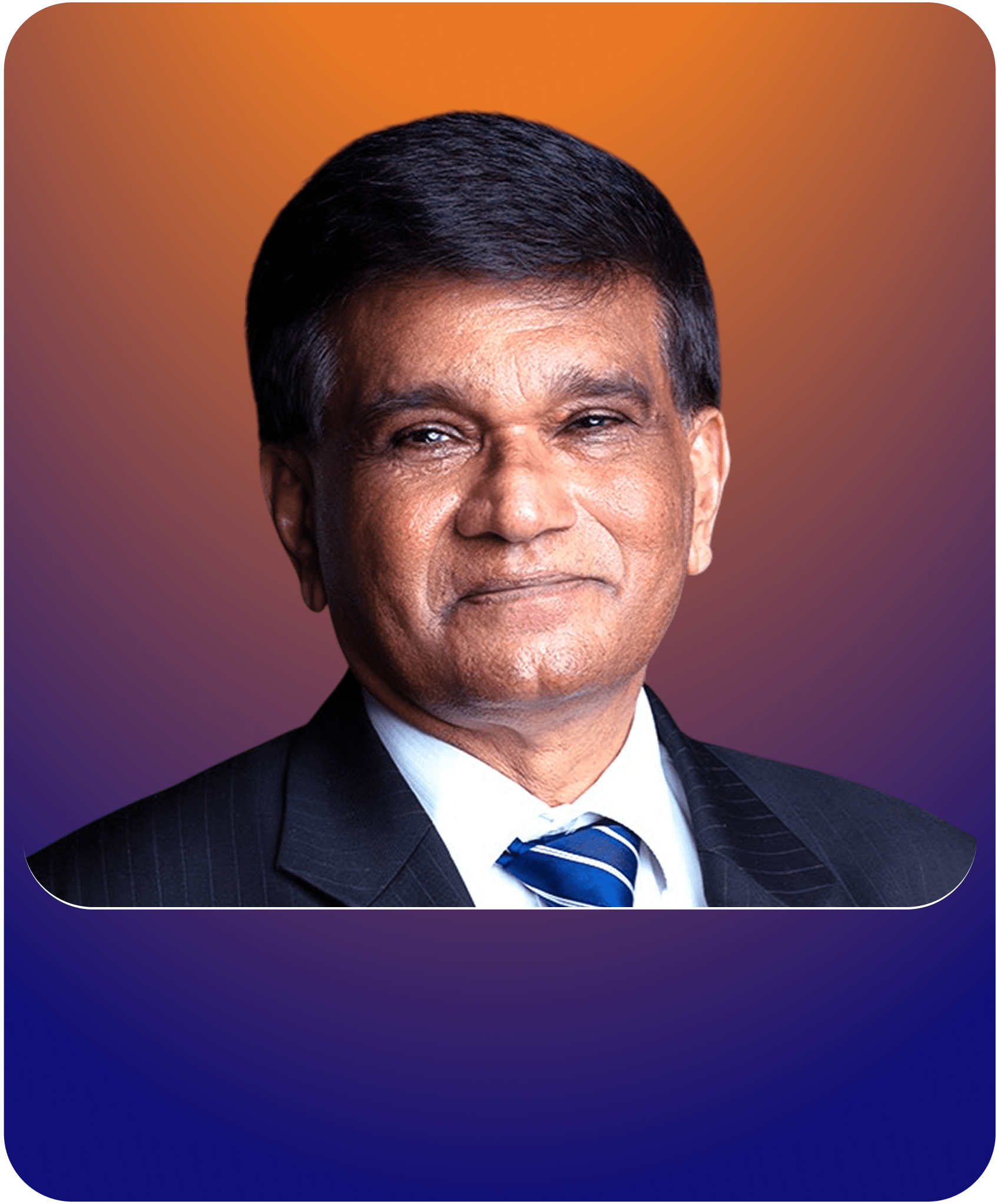 Professor Jugdutt Singh, a Board Member of SKJV. He is dressed formally in a dark suit and striped tie